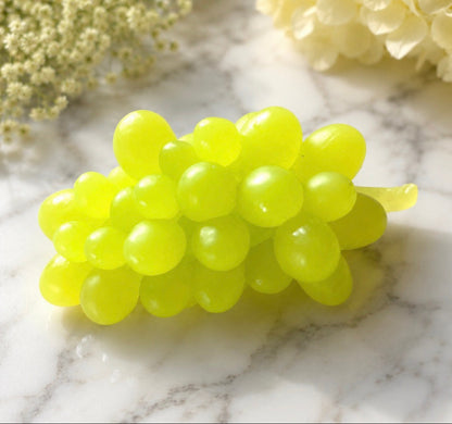 Bunch of green grapes soap on a marble surface
