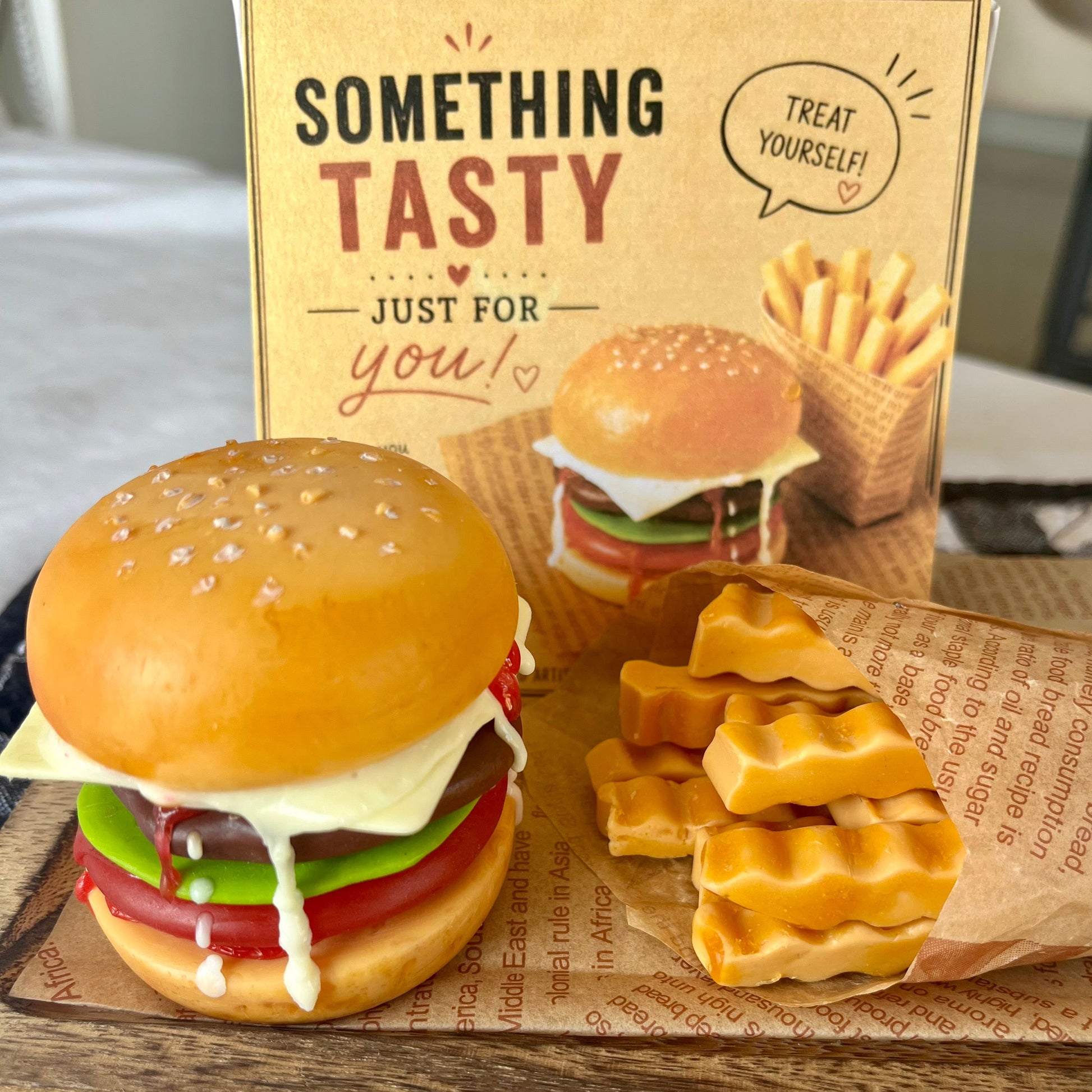 Handmade cheeseburger and fries soap gift set with decorative greeting card. Realistic fast food inspired novelty soap, beautifully presented for birthdays and unique gifts.