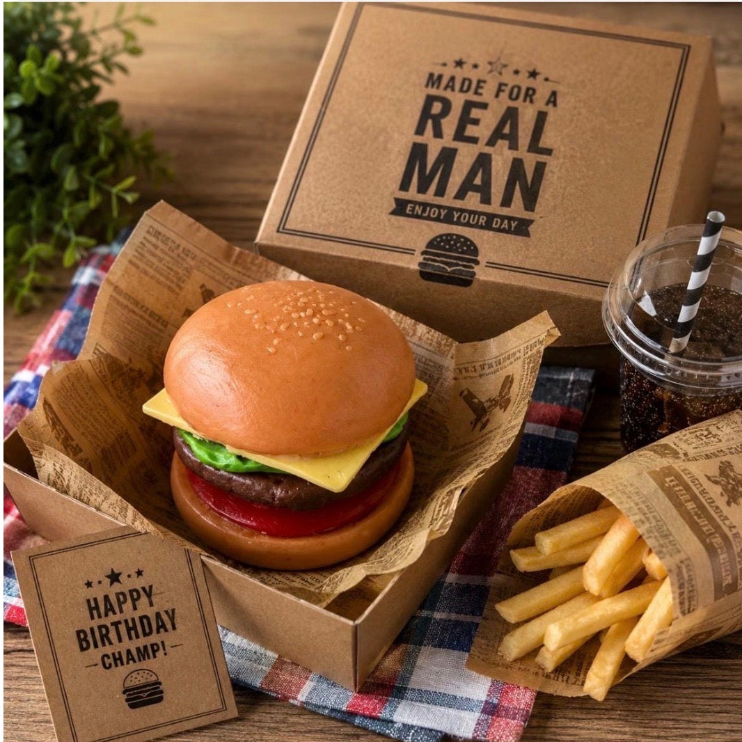 Handmade cheeseburger soap presented in a gift box with realistic fries soap. Funny food-inspired soap gift for men, women and burger lovers.
